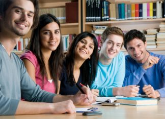 Group of young students studying