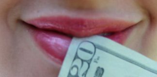 woman's mouth with $20 bill