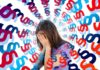 woman holding her face, letters around her