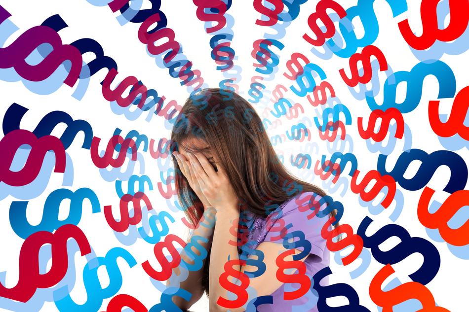 woman holding her face, letters around her